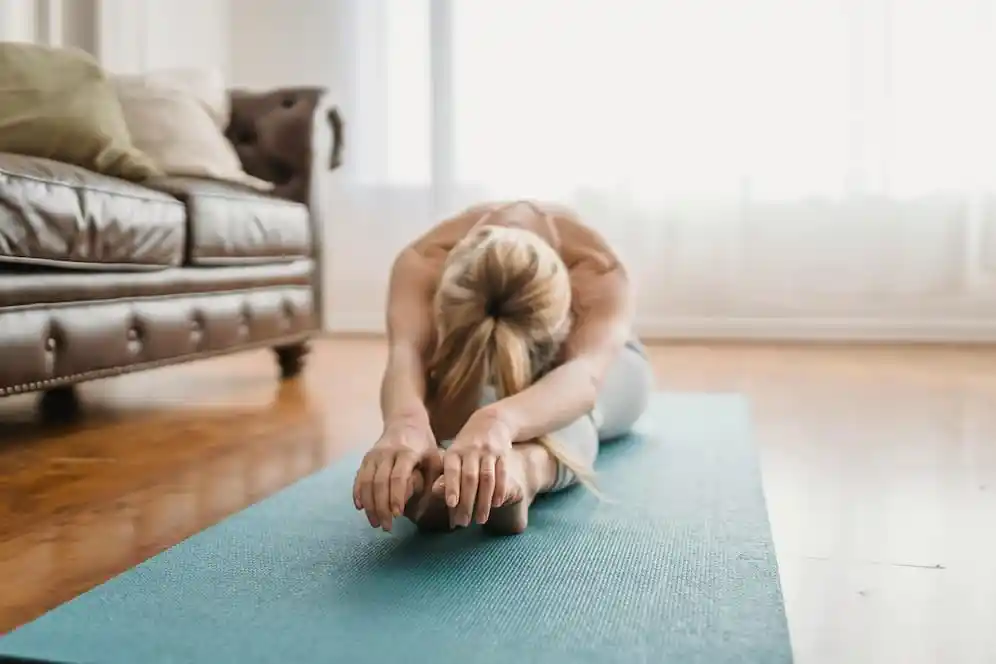 A woman touches her toes