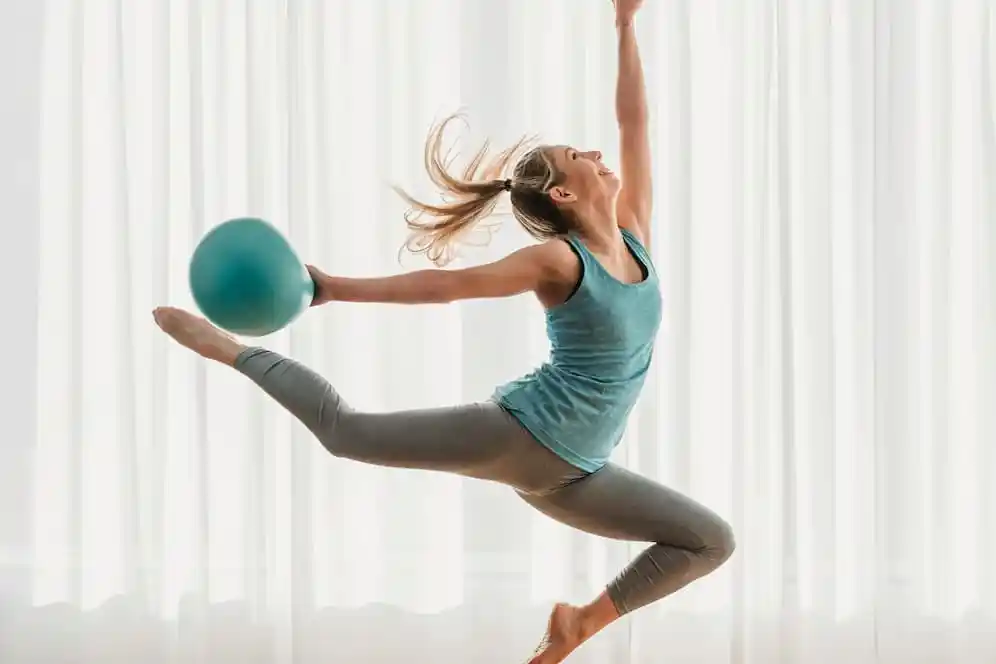 A woman poses in mid air