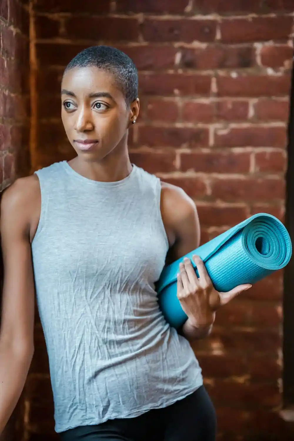 A woman is ready to begin her yoga session