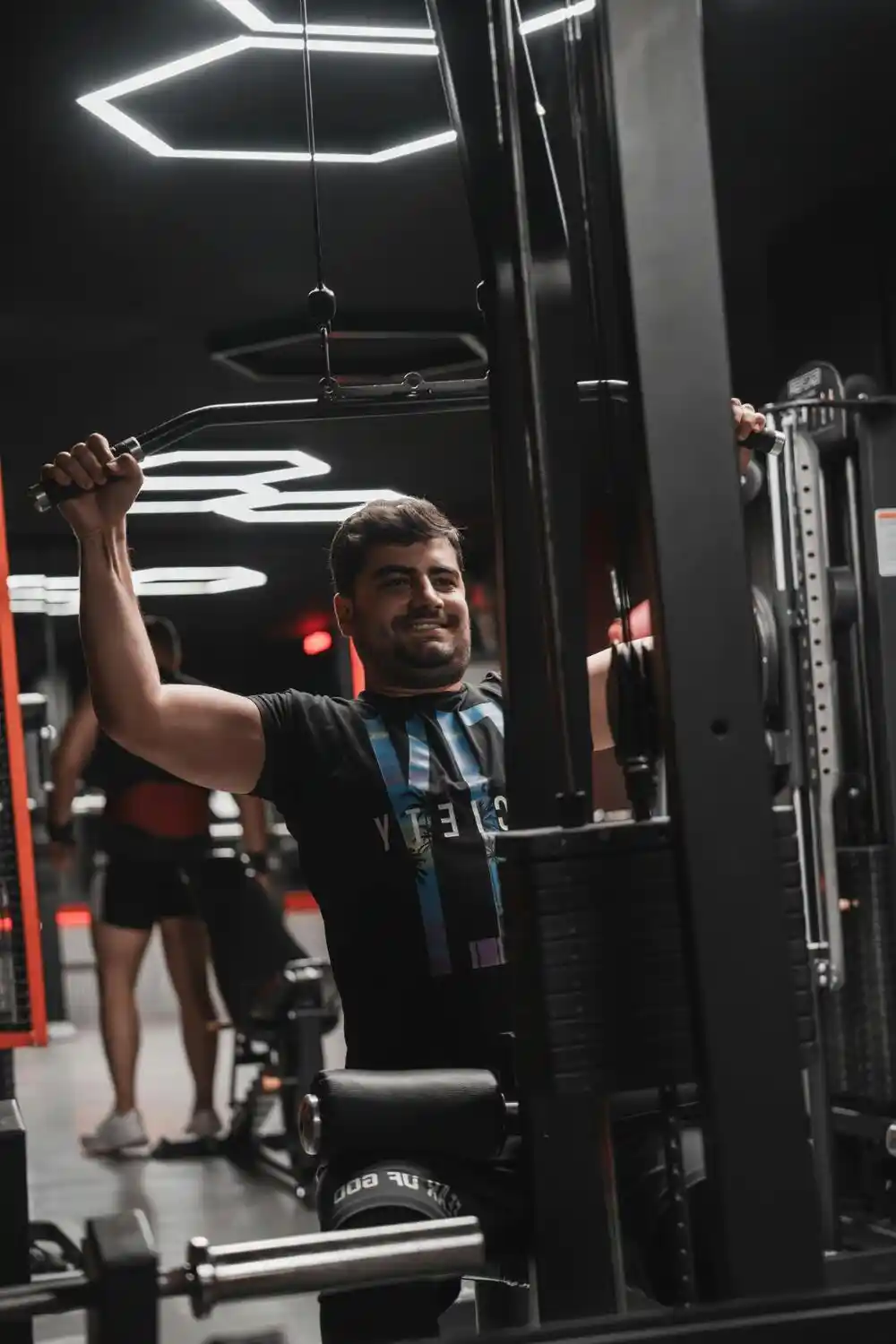 A man uses a weights machine